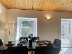 a dining room with a table and chairs at homy Alpenlodge in Innerbraz