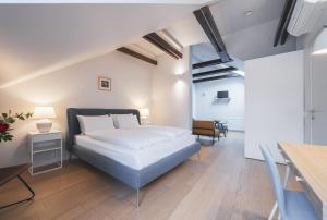 Postel nebo postele na pokoji v ubytování Lollo Residence - Lollo Luxury