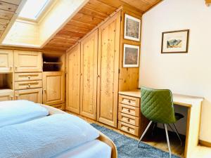 Posteľ alebo postele v izbe v ubytovaní Chalet Bernardi Apartments