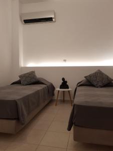 Posteľ alebo postele v izbe v ubytovaní Theti Apartment