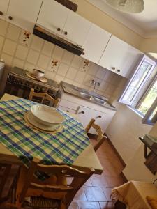 a kitchen with a table with a plate on it at Casetta della chiocciola in Sassi