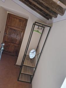 a room with a stair case and a door at Casetta della chiocciola in Sassi