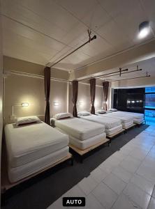 Giường trong phòng chung tại Monkey Toe Guesthouse