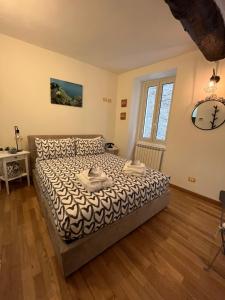 A bed or beds in a room at Casa romantica sul lago di Como
