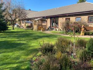 a house with a yard with green grass at Drummond Neuk - Pets Welcome free, country setting, free onsite parking in Inverness