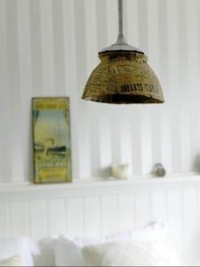 a lamp that is on top of a wall at Torpet Mon in Gothenburg