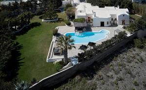 an aerial view of a house with a swimming pool at Aquaria Villa in Karterados