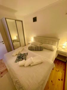 a bedroom with a bed with two pillows on it at Apartment Soreja in Ulcinj
