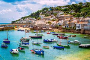 a group of boats in the water in a harbor at Pendragon in Penzance +32 photos