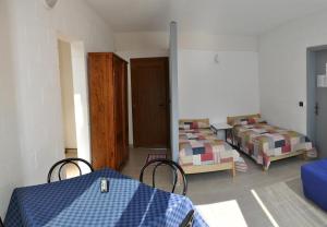Postel nebo postele na pokoji v ubytování Camping Villaggio Paradiso