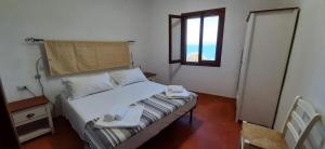 Säng eller sängar i ett rum på Villa Clementina - Sant'Antioco