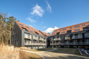 two apartment buildings with at Sunset Apartment in Juodkrantė