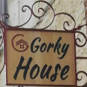 a sign for a gory house hanging on a building at GorkyHouseUrla in Ildır