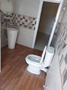 a bathroom with a toilet and a sink at فيلا مارينا٥ على البحيره ٥ غرف in El Alamein