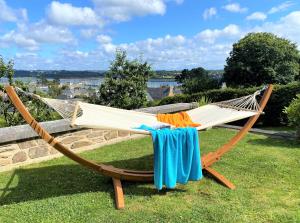 a hammock on the grass in a yard at Ma Ripoz B&B in Perros-Guirec