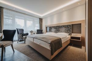 Postel nebo postele na pokoji v ubytování Hotel Graf Bentinck + 37 fotografií