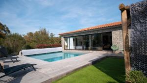 a backyard with a swimming pool and a house at villa rocca in Sotta