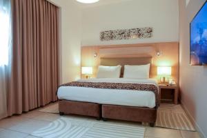 Posteľ alebo postele v izbe v ubytovaní Toledo Amman Hotel