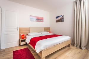 Posteľ alebo postele v izbe v ubytovaní Apartments Villa Ankora