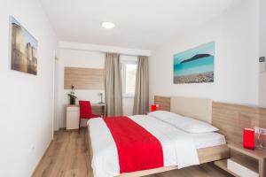 Posteľ alebo postele v izbe v ubytovaní Apartments Villa Ankora