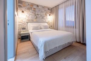 Postel nebo postele na pokoji v ubytování Hanedan Otel Foca Izmir
