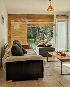 a living room with a couch and a table at Casa del Sur in San Carlos de Bariloche