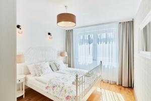 Łóżko lub łóżka w pokoju w obiekcie Villa Astoria