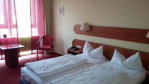 Postel nebo postele na pokoji v ubytování Hotel Berliner Ring