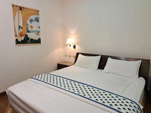 Postel nebo postele na pokoji v ubytování 澎湖民宿 7 Hostel