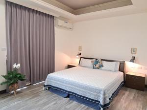 Postel nebo postele na pokoji v ubytování 澎湖民宿 7 Hostel