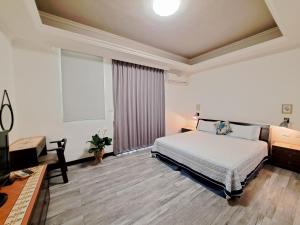 Postel nebo postele na pokoji v ubytování 澎湖民宿 7 Hostel