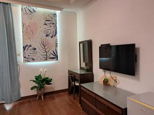 TV a/nebo společenská místnost v ubytování 澎湖民宿 7 Hostel + 12 fotografií