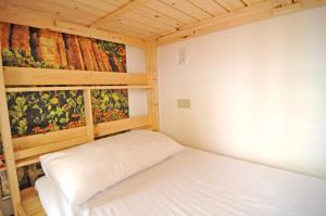 Postel nebo postele na pokoji v ubytování 澎湖民宿 7 Hostel