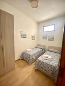 Posteľ alebo postele v izbe v ubytovaní La casa dei bouganville Lo stagnone