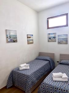 Posteľ alebo postele v izbe v ubytovaní La casa dei bouganville Lo stagnone