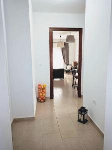 a hallway with a door leading to a living room at Maravilloso Centro Sanlucar in Sanlúcar de Barrameda