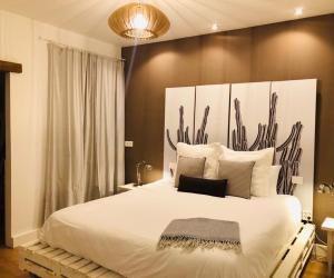 A bed or beds in a room at Nuevo Apartamento en Playa de las Canteras
