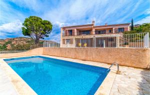 a swimming pool in front of a house at Domaine De La Bastide Dagay in Anthéor