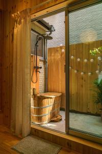 a large bathroom with a tub and a shower at Spacious 80m2 Private House, central Tokyo in Tokyo