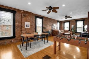 a living room with a ping pong table at Urban Loft 2-story 1BR Near DT on Historic Street in Columbus