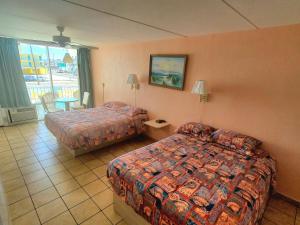 Postel nebo postele na pokoji v ubytování Caprice Motel - Wildwood