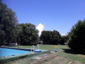 a swimming pool with a fire in the background at Aeroporto Ciampino a soli 600 Mt Bici Grill Decimo Miglio in Ciampino
