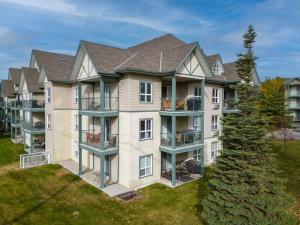 an aerial view of a large apartment building with balconies at Polar Peaks Hot Tub Pool Gas Fireplace in Radium Hot Springs