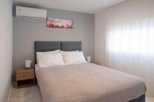 Voodi või voodid majutusasutuse Mythos Home toas