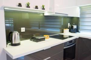 Köök või kööginurk majutusasutuses Mythos Home