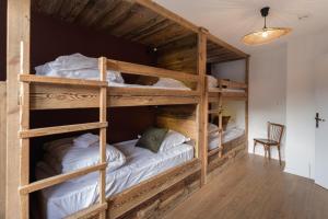 Postel nebo postele na pokoji v ubytování Hôtel Maison Doron
