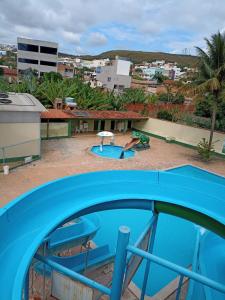 a view of a swimming pool from the roof of a building at Aconchego Sertanejo in Caetité