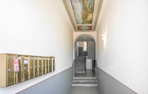 a hallway with stairs and a painting on the ceiling at Cozy Apartment In Le Grazie With Kitchen in Le Grazie