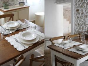 姆蘇蘭特的住宿－Borgo Faveri by BORGHI VENETI，一张桌子上放有盘子和酒杯