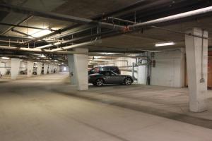 a car parked in an empty parking garage at Silver Rock Condominiums by Fernie Central Reservations in Fernie